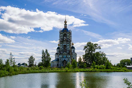 landscape rural Orthodox church, a church in the village of Pruzhinino, Kostroma region, Russia, built in 1804.の写真素材