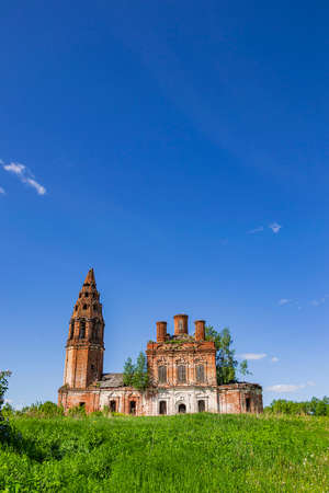 landscape abandoned Orthodox church, Nikitskoye village, Kostroma province, Russia. The year of construction is 1789. Currently, the temple is abandoned.の写真素材