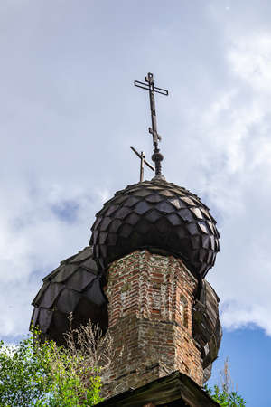 domes of an old abandoned church, the village of Sukhorukovo, Kostroma province, Russia. The building was built at the end of the 18th century. Currently, the temple is abandoned.の写真素材