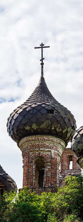 domes of an abandoned Orthodox church, Buyakovo village, Kostroma province, Russia. The year of...