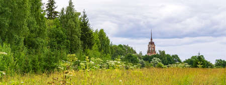 landscape, abandoned Orthodox bell tower, Gorinskoe tract, Kostroma province, Russia. The year of construction is 1809.の写真素材