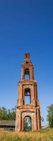 an old abandoned bell tower, the temple of the village of Golovinskoye, Kostroma province, Russia. The year of construction is 1802. Currently, the temple is abandoned.の写真素材