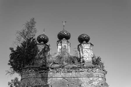 domes of an abandoned church, church of the village of Spasskoye, Kostroma province, Russia. The...