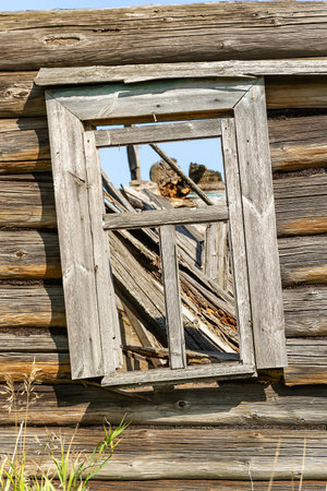 windows of destroyed wooden houses, abandoned villages, Russia 2021
