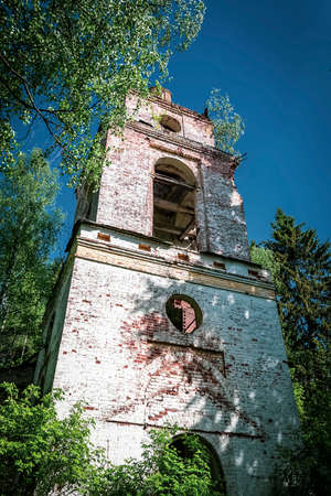 stone Orthodox bell tower, Russia, Vladimirovo tract, year of construction 1809 currently the temple is abandonedの写真素材