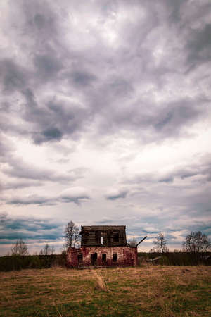destroyed lonely two-story old house landscapeの写真素材