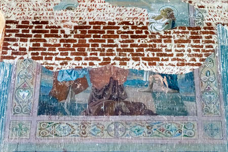 pictures on the wall of an abandoned temple, the temple of the village of Stolpino, Kostroma region,...