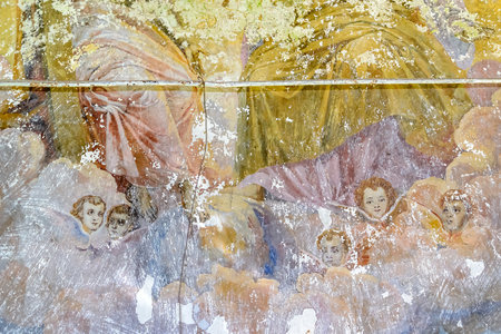 frescoes on the walls of an abandoned temple, angels. The temple of the village of Borisoglebskoye, Kostroma region, Russia. The year of construction is 1821. Currently, the temple is abandoned. Photo of the year 2022.の写真素材