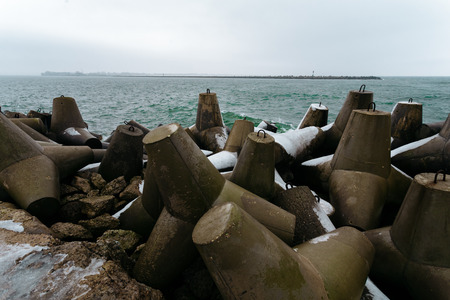 Many breakwaters with snow on the northern mall in the town of Baltiysk, Kaliningrad, Russia.の写真素材