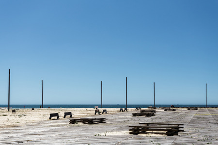Wooden embankment near the ocean in portugalの写真素材