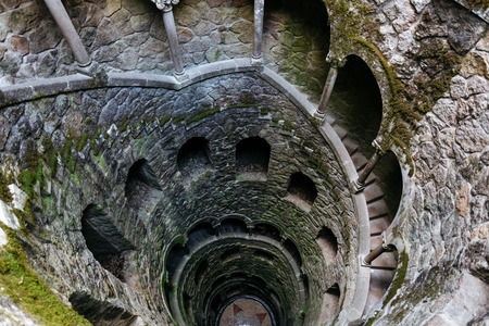 Initiation Wells. Deep well in the territory of Quinta da Regaleira. Old spiral staircase goes down.の写真素材