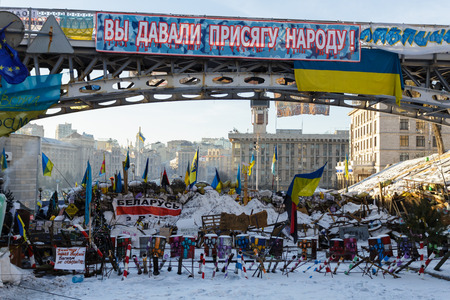 Kiev, Ukraine - February, 2014 - The barricades of tires, barrels, sand and iron against the police during the Maidan at the Independence Square in Kiev, Ukraine at winter day.のeditorial素材