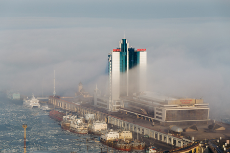 Odessa, Ukraine - February, 2014 - Hotel Odessa and seaport among fog in the city of Odessa, Ukraine.のeditorial素材