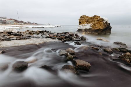 Winter in Odessa. Cool Black Sea with rockの写真素材