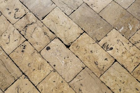 European tiles on the street of stone exactly on top.