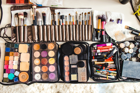 makeup cosmetics and brushes on the white tableの写真素材