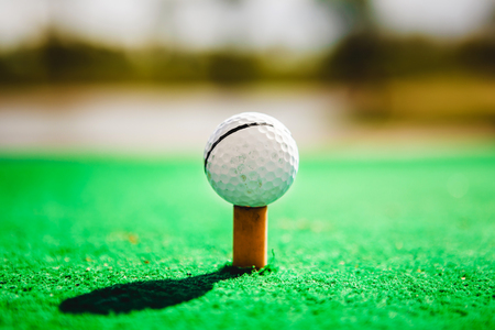 golf ball on tee close upの写真素材