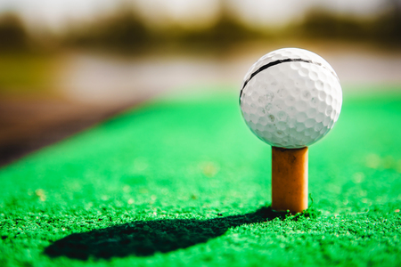 golf ball on tee close upの写真素材