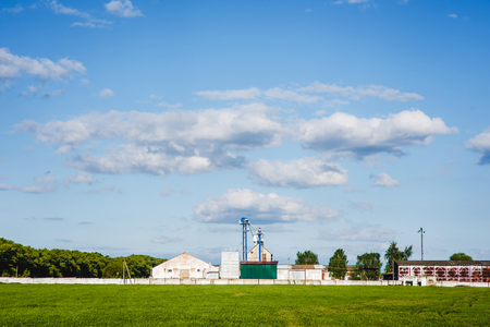 farm grain silos for agriculture with blue sky on the backgroundの写真素材
