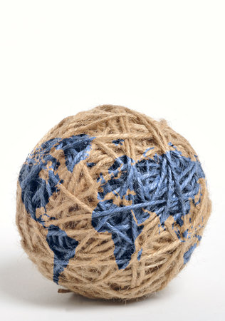 Earth map printed on a ball of stringの写真素材