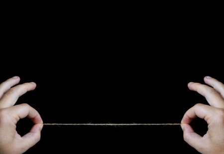 Photography of hands holding a stringの写真素材