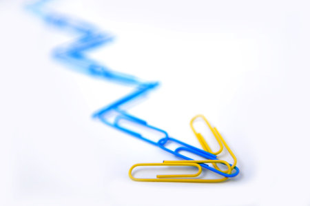 Blue paper clips connected in a conceptual chart - selective focus on foregroundの写真素材