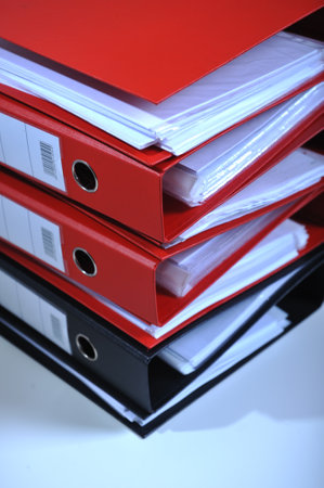 Stack of red folders on desk, deadline conceptの写真素材