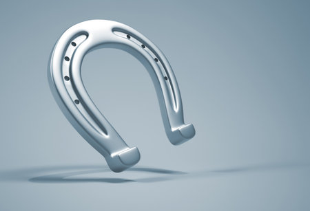 Silver horseshoe over blue background - 3d renderの写真素材