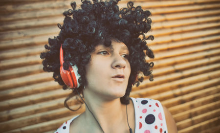 Girl listening to music on headphonesの写真素材