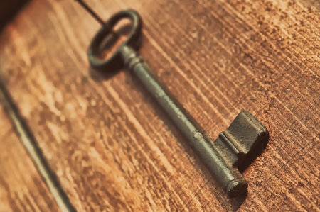 Vintage key on old wooden backgroundの写真素材