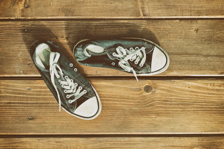 Sneakers on floor on wooden backgroundの写真素材
