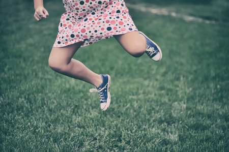 Girl running outdoorsの写真素材