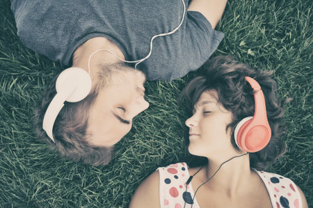 Couple listening to music on headphones