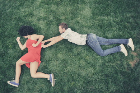 Boy and girl in the grassの写真素材