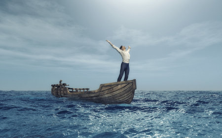 Man with his arms rised to the sky in a boat at sea . This is a 3d render illustrationの写真素材