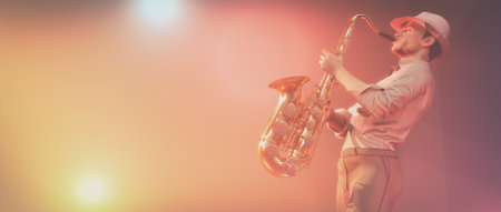 Young man play saxophone on the stage in the colorful highlights. This is a 3d render illustrationの写真素材