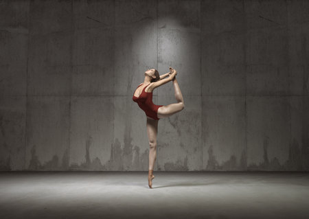 Young and beautiful gymnast posing in a red costume. This is a 3d render illustration.の写真素材