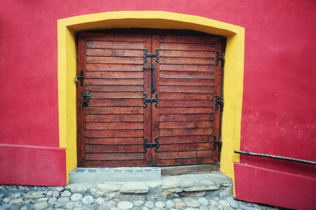 Old wooden double door in the Fortress Sighisoara, Transylvania, Romaniの写真素材