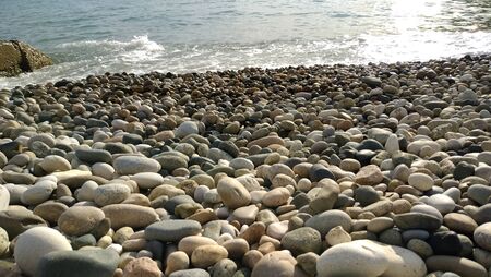 seashore with a beautiful gray stonesの写真素材