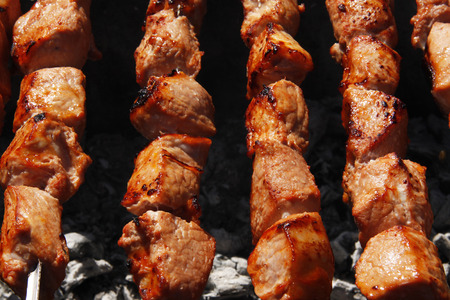 beautiful kebab on skewers over a campfireの写真素材