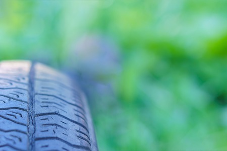 Car tire on the background of nature, horizontal orientationの写真素材
