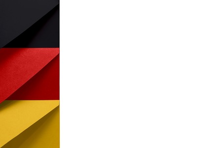Black, red, yellow envelopes on the left of a white background symbolize the colors of the Federal Republic of Germany flagの写真素材