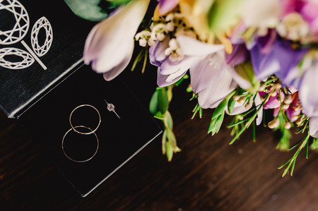 The composition of the wedding rings and flowersの写真素材