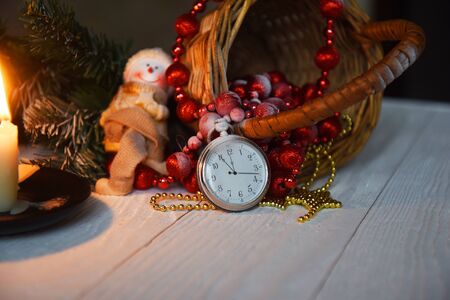 Christmas still life antique pocket watch candle and Christmas decorationsの写真素材