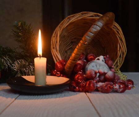 Christmas still life antique pocket watch candle and Christmas decorationsの写真素材