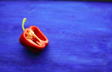 red sweet pepper on a blue backgroundの写真素材