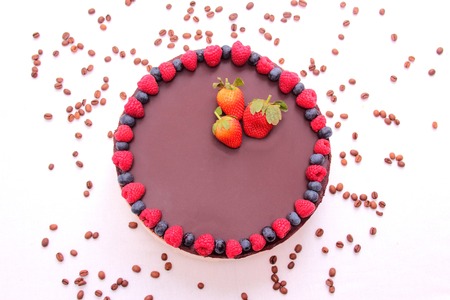 Cake souffle, covered with chocolate, jewelry, berries, raspberry, blueberry, blueberry, strawberry,...