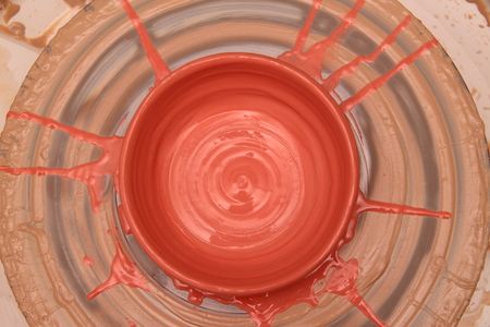 Cay pot painted on a potter wheel, modeling of pot hands, the sculpting of the hands.の写真素材