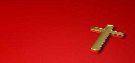 Gold cross on red backgroundの写真素材