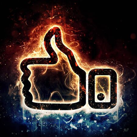 Thumb up sign with burning elementsの写真素材